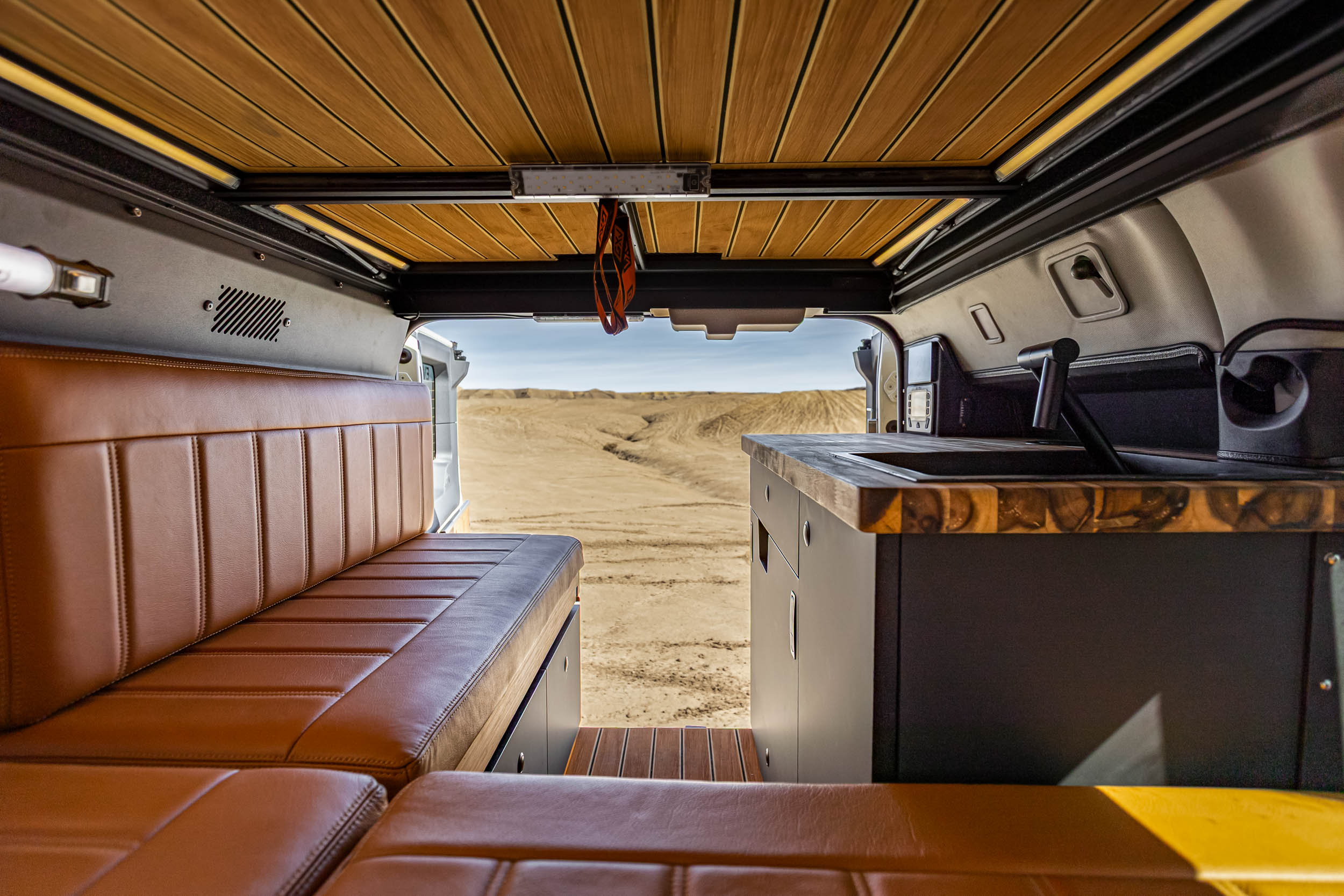 Modern interior of the Grand Bohemian featuring leather seating and a stainless steel micro-galley.
