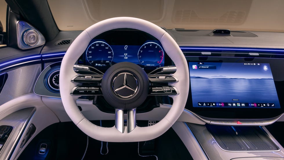 The front cabin of the 2027 S-Class featuring the MBUX Superscreen and Manufaktur deep white and black interior.