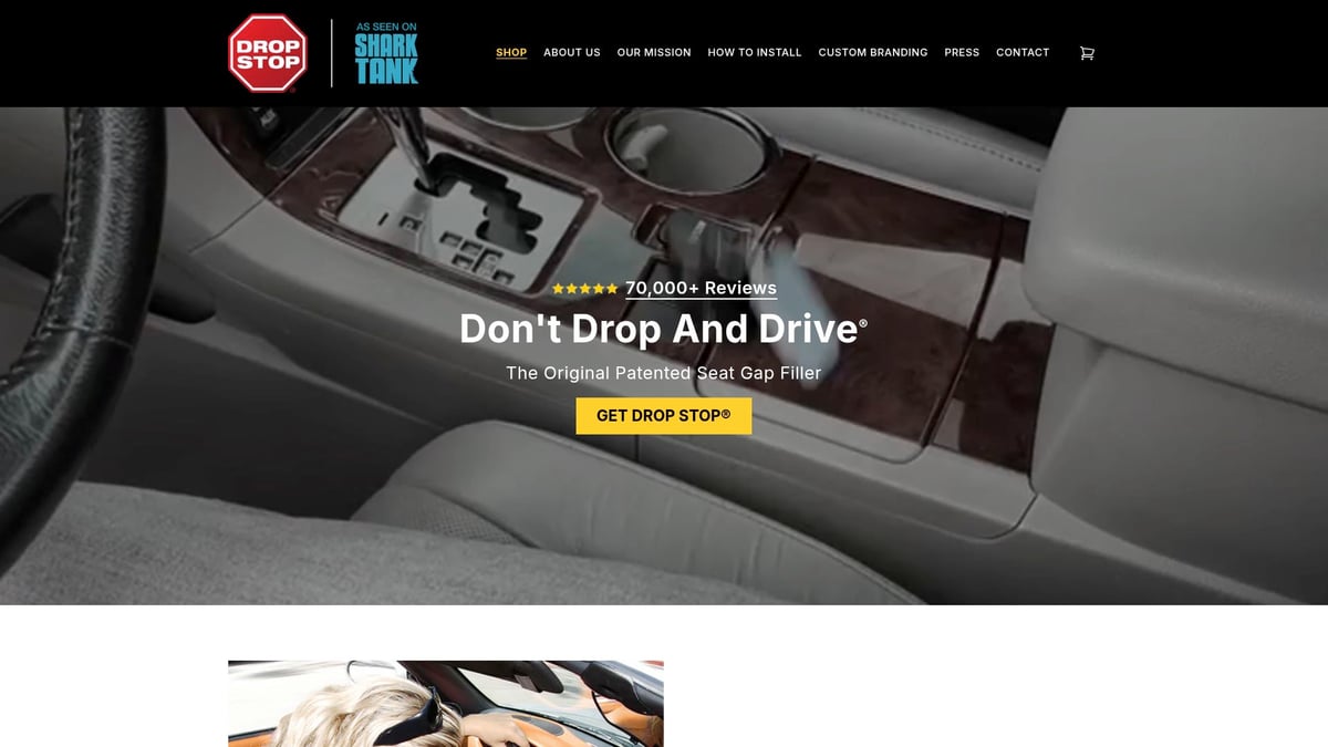 A car seat gap filler installed between the driver seat and center console.