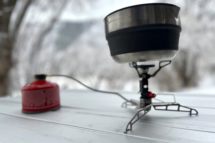 Close-up detail of the Sea to Summit Detour pot handle and lid showing the locking mechanism.