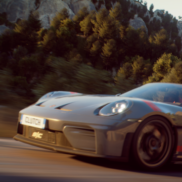 High-definition racing game visuals showing a performance car on track.