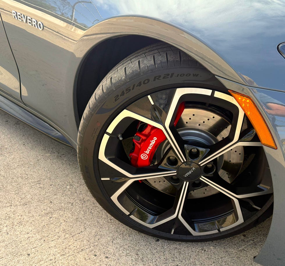 Side profile of the Karma Revero showing its long hood and flared fenders.