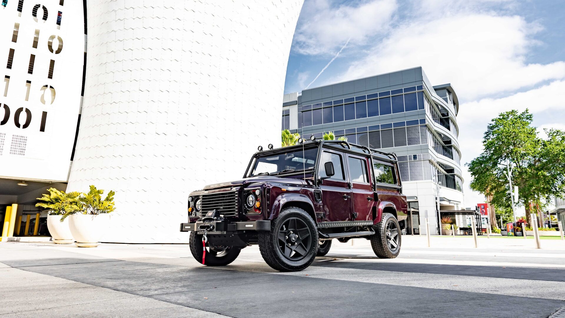 The underside of an all-electric Land Rover Defender showing the drivetrain components.