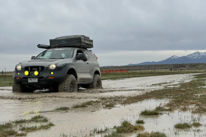 Close-up of the mechanical underbody and suspension components of an Isuzu VehiCROSS.