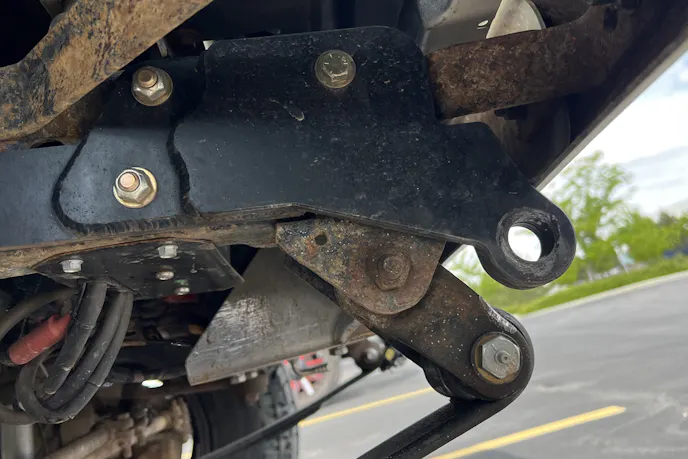 Close-up of a Dana 44 front axle and off-road suspension components on a Jeep J10.