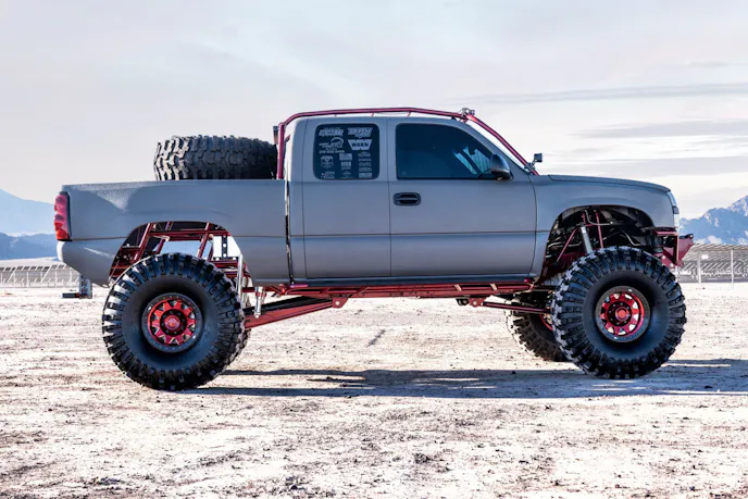 Side profile of the custom off-road Silverado showing suspension and tires.
