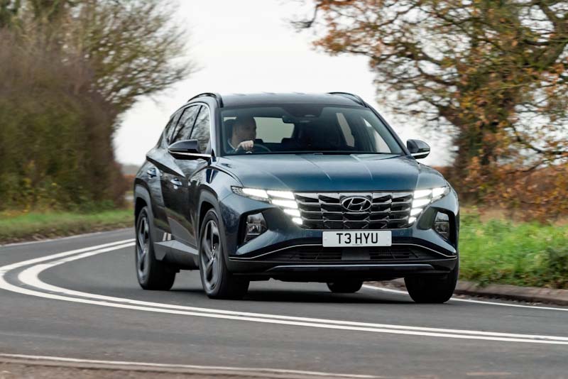 The front of a modern Hyundai Tucson Hybrid SUV.