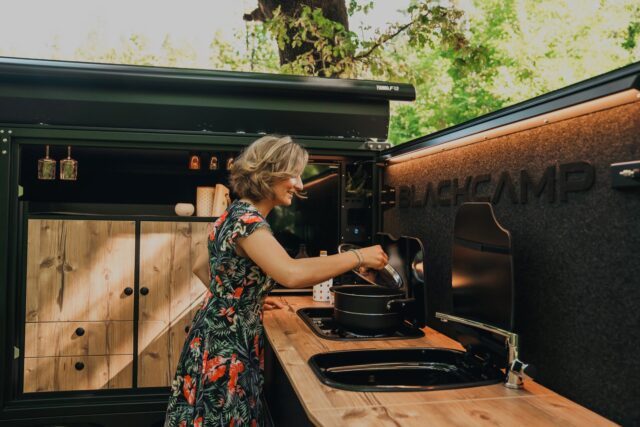 Close-up of the Blackcamp Freeda's integrated slide-out outdoor kitchen