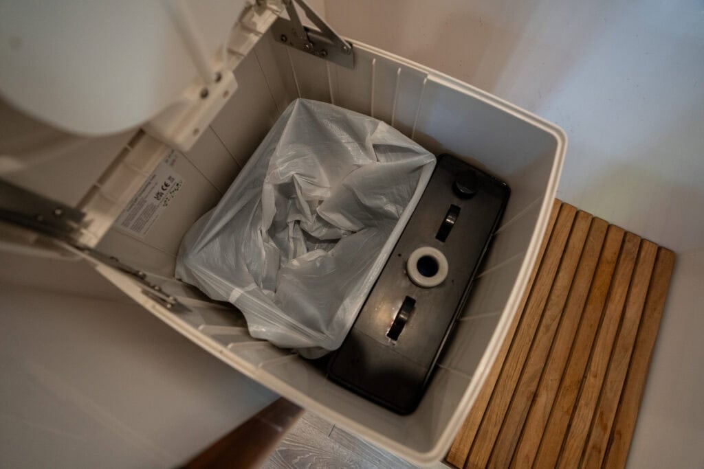 Internal overhead view of the CompoCloset Cuddy Lite showing the urine diverter and the solids compartment.